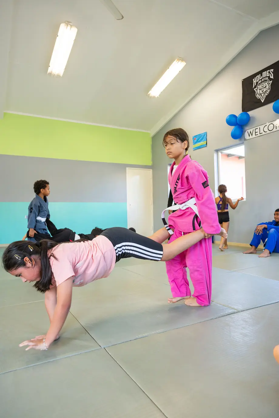Students training on the mat