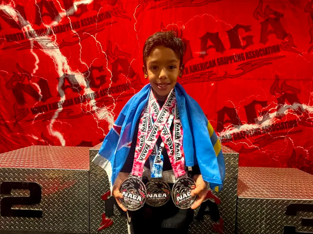 Young champion at a grappling championship