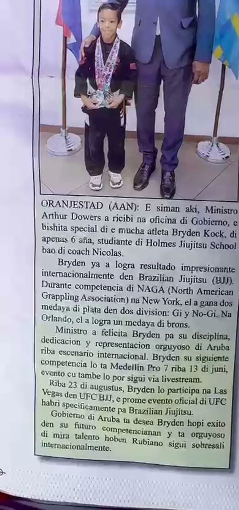 National newspaper feature on a Holmes Jiu Jitsu athlete received by the Minister of Aruba